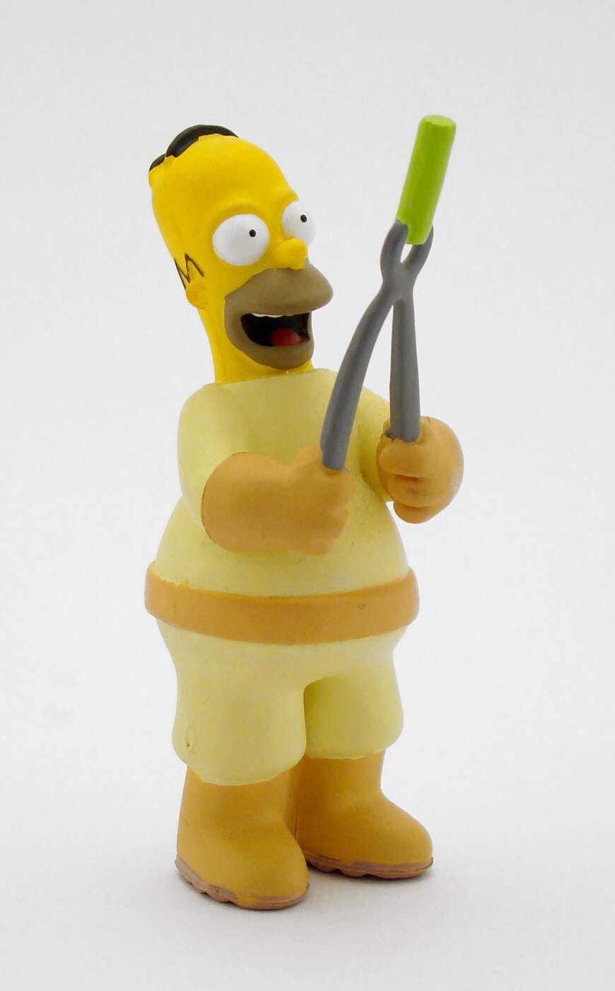 Homer Simpson Figur mit Grillzange, lächelnd Homer Simpson - Die Simpsons - (c) Bild von Tiago Sierra sierratds auf Pixabay